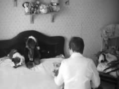 A sultry lady browses a porn magazine before masturbating on a concealed camera.